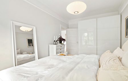 Arranging the walls in a bedroom with white furniture